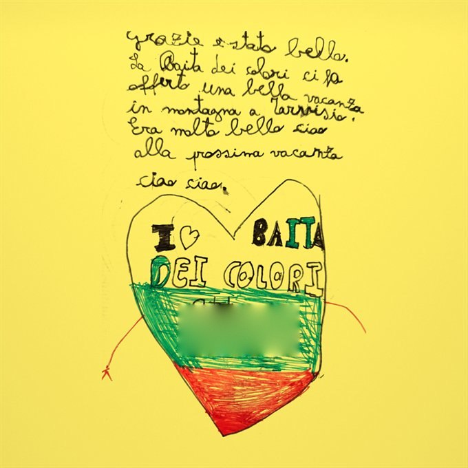 Messaggio nel libro delle presenze, disegno di un cuore con la scritta “I love Baita dei Colori”